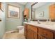 Well-lit bathroom featuring a vanity, mirror, and neutral tones at 487 Glendale Ct, Stone Mountain, GA 30087