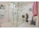 Bathroom with a glass-enclosed shower, a toilet, and light tile flooring at 487 Glendale Ct, Stone Mountain, GA 30087