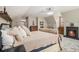 Spacious bedroom featuring a fireplace, comfortable bed and stylish furnishings at 487 Glendale Ct, Stone Mountain, GA 30087