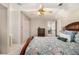 Comfortable bedroom with ceiling fan, soft carpet and a large bed with floral pattern bedding at 487 Glendale Ct, Stone Mountain, GA 30087