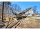 Charming two-story home featuring a wooden deck, garage, and a well-manicured lawn at 487 Glendale Ct, Stone Mountain, GA 30087