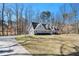 Charming two-story home with a manicured lawn, attached garage, and a long driveway at 487 Glendale Ct, Stone Mountain, GA 30087