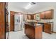 Modern kitchen featuring stainless steel appliances, granite countertops, and a center island at 487 Glendale Ct, Stone Mountain, GA 30087