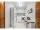 Bright laundry room featuring modern appliances, storage cabinets and tile floor at 487 Glendale Ct, Stone Mountain, GA 30087