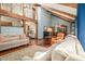 Spacious living room showcasing hardwood floors, exposed beams, and a staircase at 487 Glendale Ct, Stone Mountain, GA 30087