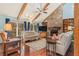 Inviting living room featuring hardwood floors, a stone fireplace, and vaulted ceilings at 487 Glendale Ct, Stone Mountain, GA 30087