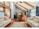Bright living room with high ceilings, exposed beams, and elegant furnishings at 487 Glendale Ct, Stone Mountain, GA 30087