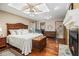 Comfortable main bedroom with a ceiling fan, an ensuite bathroom, and a walk-in closet at 487 Glendale Ct, Stone Mountain, GA 30087