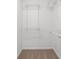 Walk-in closet with white shelving, offering ample storage space with carpeting at 1221 Rubble Road Rd, Cumming, GA 30040