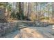 Stone wall feature in the back yard at 11120 Surrey Park Trail, Johns Creek, GA 30097