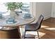 Cozy breakfast nook featuring an oval table, comfortable seating, and warm natural light from the window at 11120 Surrey Park Trail, Johns Creek, GA 30097