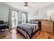 Bedroom with hardwood floors, natural light, and classic furnishings at 957 Ross Ct, Stone Mountain, GA 30087