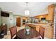 Kitchen featuring a breakfast bar, stainless steel appliances, and a dining area at 957 Ross Ct, Stone Mountain, GA 30087