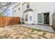 A fully fenced backyard features a stone paver area and access to the home through a glass door at 32 Hampton Dr, Cartersville, GA 30121