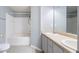 Bathroom featuring a soaking tub, dual sink vanity with ample counter space, and modern fixtures at 32 Hampton Dr, Cartersville, GA 30121