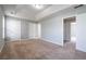 Expansive bedroom with soft carpeting, white trim, and multiple doorways at 32 Hampton Dr, Cartersville, GA 30121