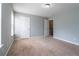 Comfortable bedroom with soft carpeting, ample natural light, and easy access to other areas at 32 Hampton Dr, Cartersville, GA 30121