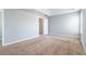 Comfortable bedroom featuring neutral walls, soft carpeting, and abundant natural light at 32 Hampton Dr, Cartersville, GA 30121