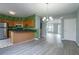 Modern dining room with new floors, unique wall decor and a breakfast bar at 32 Hampton Dr, Cartersville, GA 30121