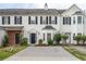 Charming townhome with black shutters, manicured landscaping and a driveway for easy parking at 32 Hampton Dr, Cartersville, GA 30121