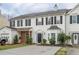 A charming townhome featuring a garage, well-maintained lawn and driveway at 32 Hampton Dr, Cartersville, GA 30121