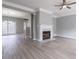 A spacious living room boasting a fireplace, modern floors, and elegant lighting at 32 Hampton Dr, Cartersville, GA 30121