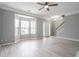 Open living room featuring bay windows and new floors at 32 Hampton Dr, Cartersville, GA 30121