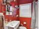 Modern bathroom features a unique vessel sink and vibrant red walls at 694 Argonne Ne Ave # 4, Atlanta, GA 30308