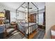 Bedroom with decorative bed, hardwood floors, and a comfortable armchair at 694 Argonne Ne Ave # 4, Atlanta, GA 30308