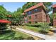 Charming brick apartment building with red tile roof and lush landscaping at 694 Argonne Ne Ave # 4, Atlanta, GA 30308