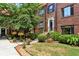 Well-maintained exterior elevation with lush plantings and brick entry walkways at 694 Argonne Ne Ave # 4, Atlanta, GA 30308