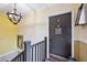 Hallway with yellow walls, dark wood railing and door with unit number at 694 Argonne Ne Ave # 4, Atlanta, GA 30308