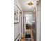 Hallway with stylish barn door, hardwood floors, and unique lighting fixture at 694 Argonne Ne Ave # 4, Atlanta, GA 30308