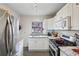 Galley kitchen with stainless steel appliances and a window view at 694 Argonne Ne Ave # 4, Atlanta, GA 30308