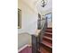 Common stairwell with dark wood railing and patterned carpet on the stairs at 694 Argonne Ne Ave # 4, Atlanta, GA 30308