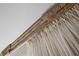 Close up showing a decorative wood window trim above flowing white draperies at 694 Argonne Ne Ave # 4, Atlanta, GA 30308
