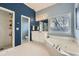 Relaxing bathroom with a soaking tub, a walk-in shower, and tile flooring at 397 4Th Ne St, Atlanta, GA 30308