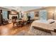 Bright bedroom with hardwood floors, desk, multiple windows, and a view of the neighborhood at 397 4Th Ne St, Atlanta, GA 30308
