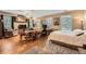 Spacious bedroom offering a bed, desk and seating, complemented by hardwood floors and an abundance of natural light at 397 4Th Ne St, Atlanta, GA 30308