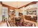 Charming dining room with decorative area rug and archway to living room, filled with natural light at 397 4Th Ne St, Atlanta, GA 30308
