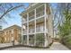 Side view of a beautiful three-story home with multi-level balconies at 397 4Th Ne St, Atlanta, GA 30308