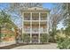 Stunning three-story home with white columned balconies and brick facade at 397 4Th Ne St, Atlanta, GA 30308