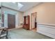 Elegant home foyer featuring a skylight, hardwood floors, and a convenient coat rack at 397 4Th Ne St, Atlanta, GA 30308