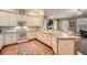 Bright kitchen featuring white cabinets, tile backsplash, and hardwood floors at 397 4Th Ne St, Atlanta, GA 30308