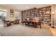 Inviting library featuring a wall of bookshelves and a comfortable seating area at 397 4Th Ne St, Atlanta, GA 30308