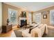 Cozy living room with a fireplace and neutral color scheme at 397 4Th Ne St, Atlanta, GA 30308