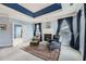 Comfortable sitting area in the main bedroom featuring a fireplace, soft carpet, and blue accents at 397 4Th Ne St, Atlanta, GA 30308
