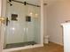 Contemporary bathroom featuring a walk-in shower with tile accents at 554 Samaritan Dr, Cumming, GA 30040