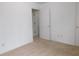 Neat bedroom featuring a door, neutral carpet, and white walls at 554 Samaritan Dr, Cumming, GA 30040