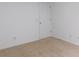 Cozy carpeted bedroom featuring neutral walls and a door with a white trim at 554 Samaritan Dr, Cumming, GA 30040